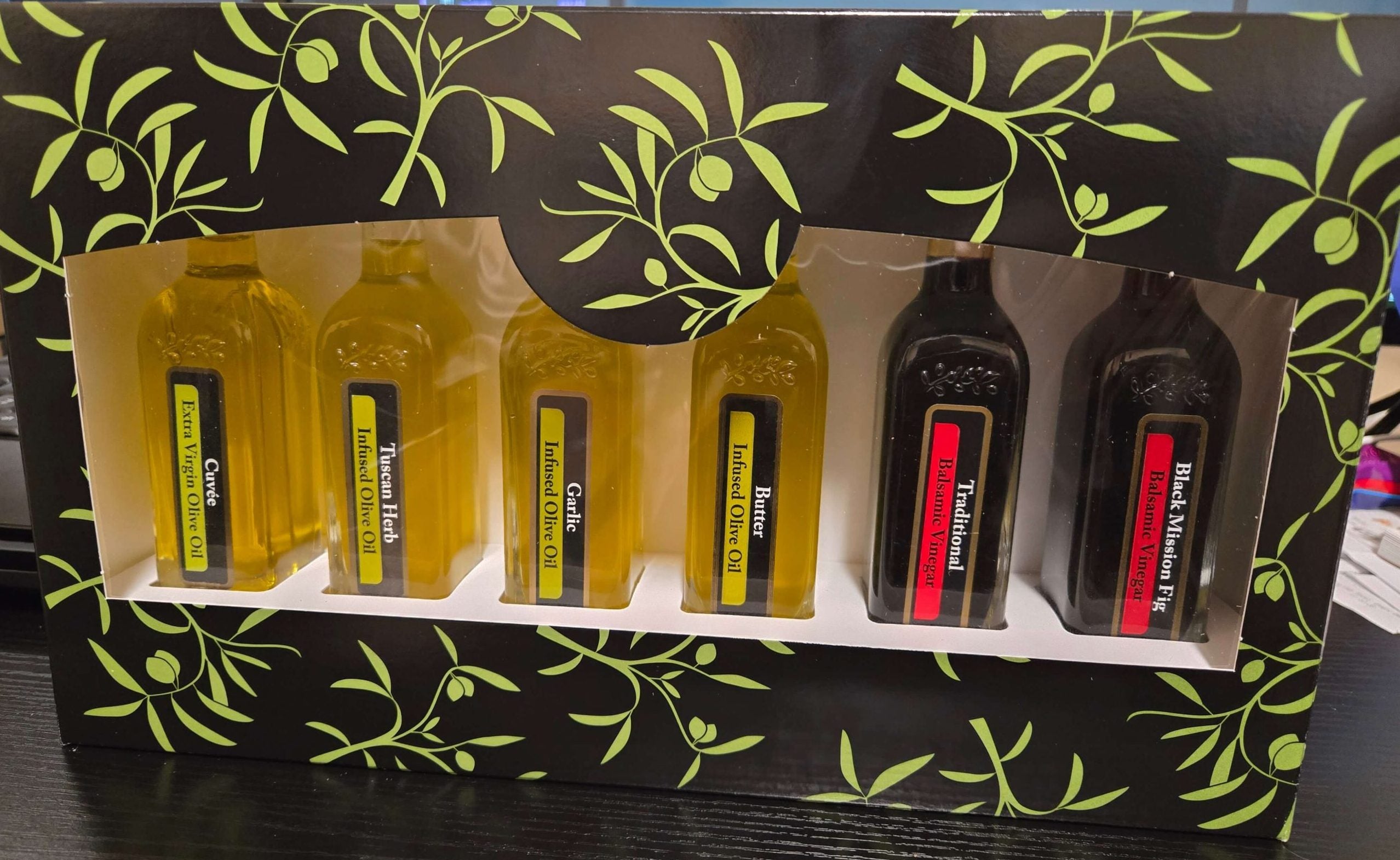 Gift set of three small bottles of olive oil and one  small bottle of balsamic vinegar