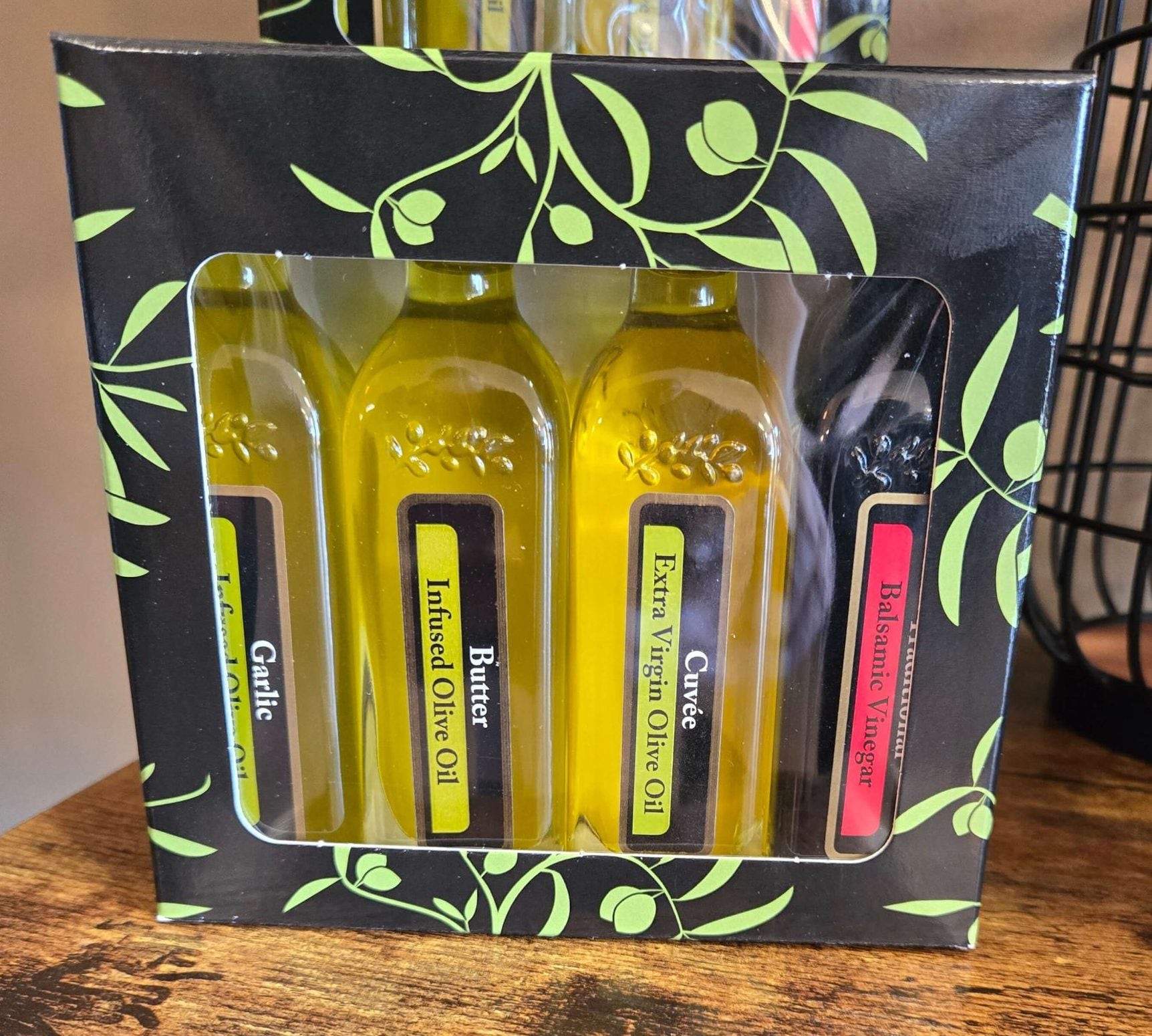 Gift set of three small bottles of olive oil and one  small bottle of balsamic vinegar