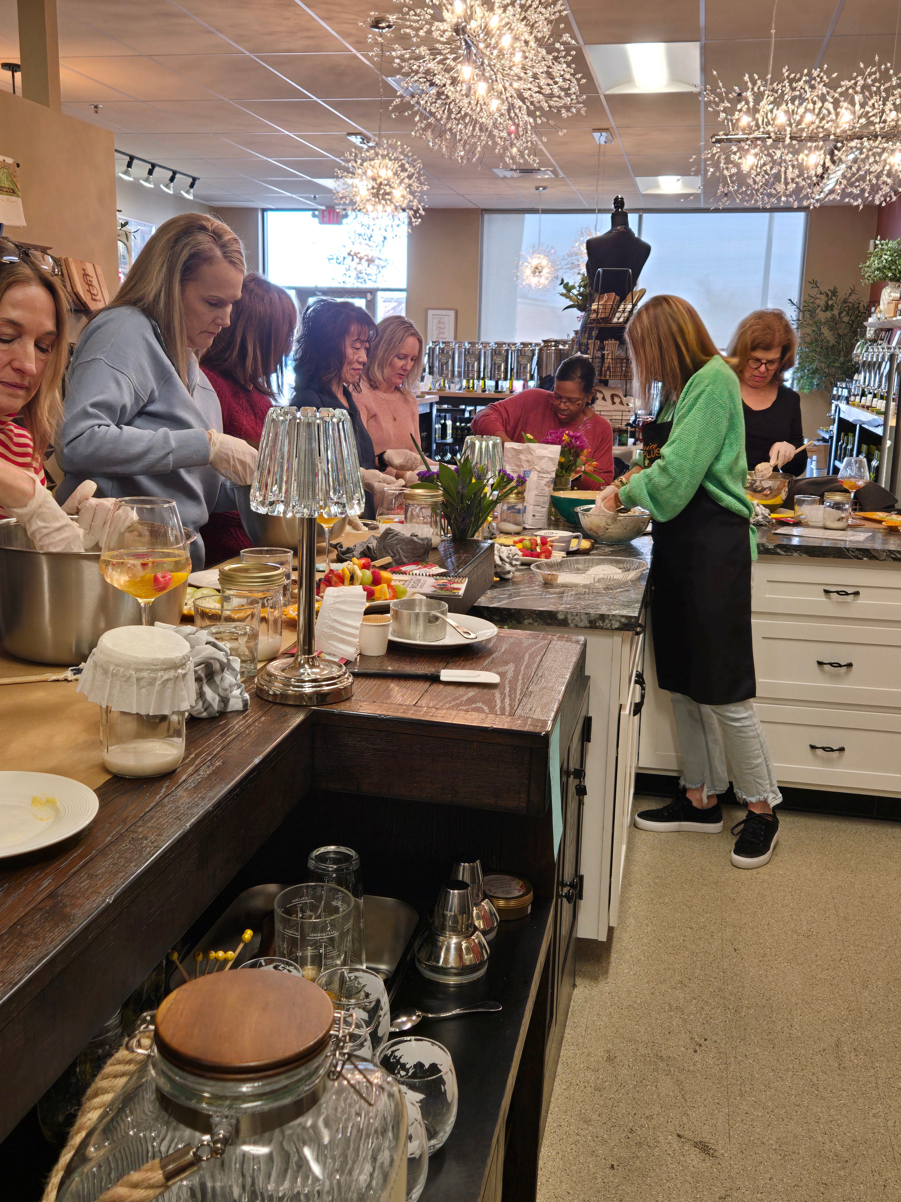 People gathered at an event at the O'LOVE store