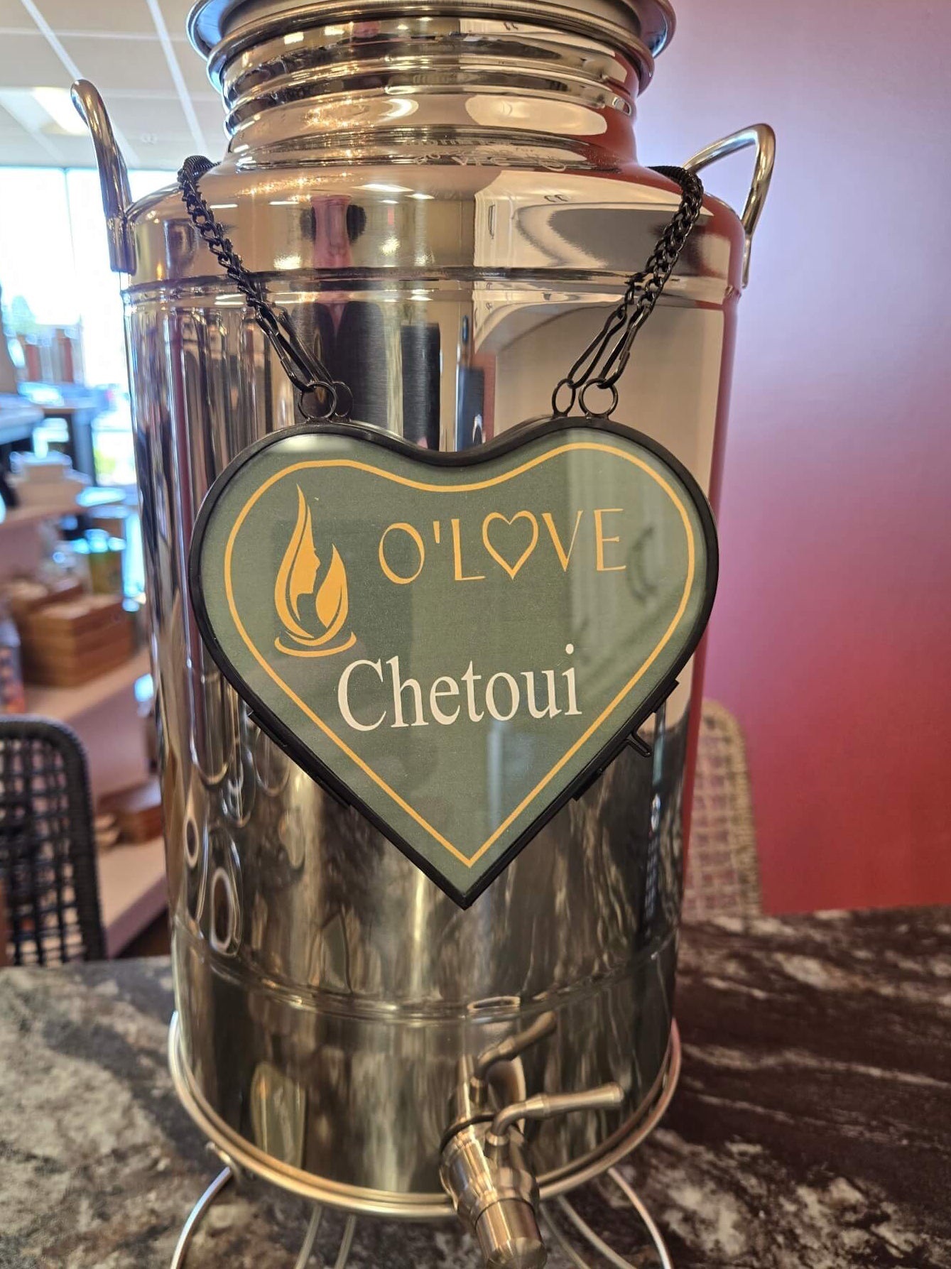 Metallic container with a heart-shaped sign reading 'O'Love Chetoui'