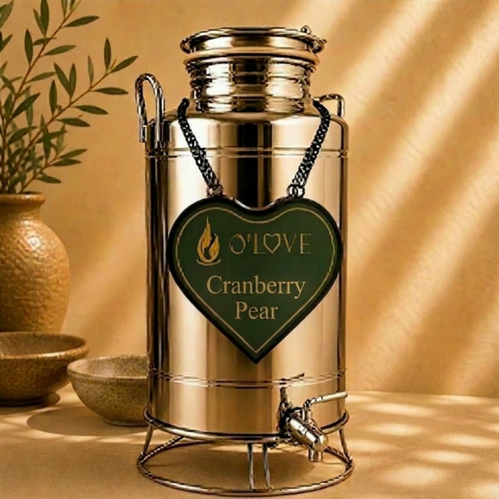 Silver herb dispenser with a heart-shaped 'O'Love Cranberry Pear' label on a beige background.