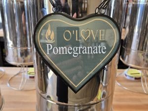 Metal container with Pomegranate sign