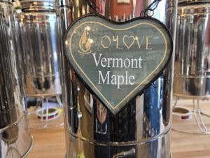 Metal container with Vermont Maple sign