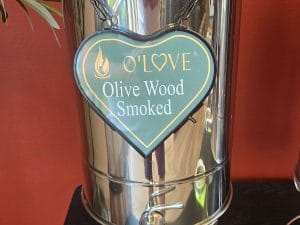 Metal container with Olive Wood Smoked sign
