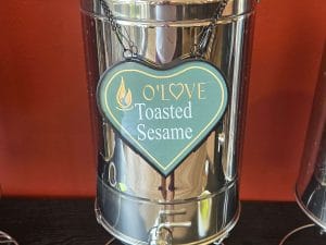 Metal container with Toasted Sesame sign